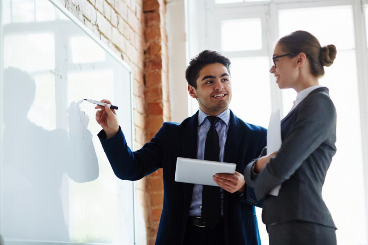 Successful business owner reviewing financial growth charts