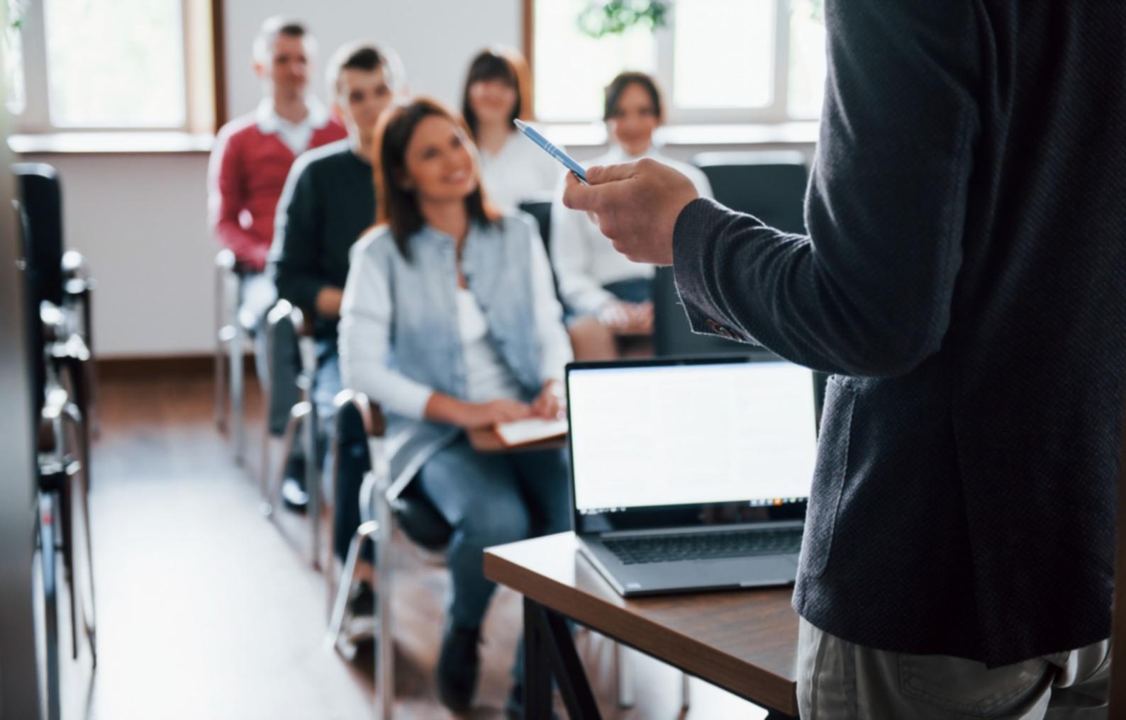 Modern classroom setup with financial charts and business planning materials